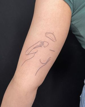 Illustrative upper arm tattoo of a woman holding a cup of tea or coffee. Designed by Dominika Gajewska.