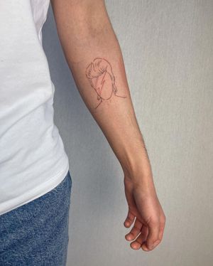 Illustrative portrait of David Bowie on forearm by tattoo artist Dominika Gajewska. Detailed and timeless man tattoo design.