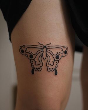 Beautiful illustrative butterfly tattoo by Kaśka, elegantly placed on the upper leg.
