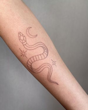 Fine line forearm tattoo featuring moon, star, and snake motifs by Dominika Gajewska.