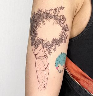Elegant and detailed floral design on upper arm by talented artist Magdalena Sawicka