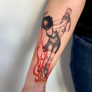 Illustrative tattoo by Magdalena Sawicka featuring a powerful witch surrounded by flames and rope details.