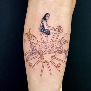 Illustrative tattoo on forearm featuring a star, goat, woman, and glasses, done by Magdalena Sawicka.