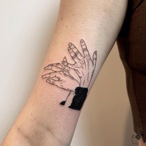 Elegant hand motif tattoo on upper arm by the talented artist Magdalena Sawicka. A stunning combination of fine line and illustrative styles.