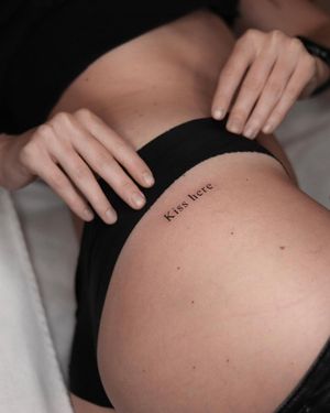 Elegantly crafted small lettering and illustrative design on upper leg. Get inspired with a meaningful quote.