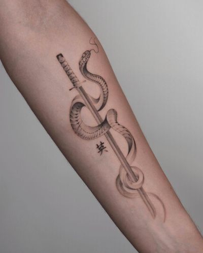 Unique black and gray design by Adrian Mokijewski combining a snake, sword, and kanji lettering.