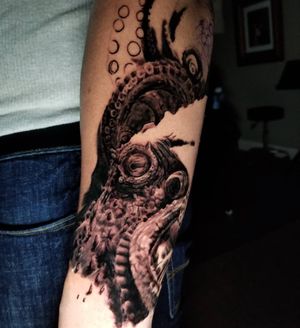 Get a stunning blackwork octopus tattoo on your forearm in Chicago, US. Unique and illustrative design.