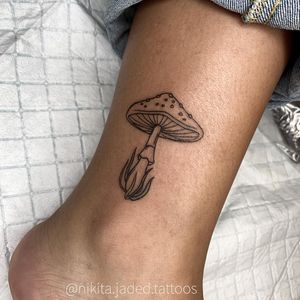 Fine-line mushroom design on ankle by Nikita Jade Morgan, combining elegance and nature.
