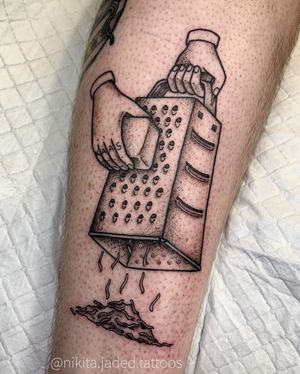 Unique blackwork tattoo of cheese and cheese grater by Nikita Jade Morgan, beautifully illustrated on the forearm.