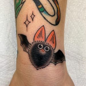 Get a stunning forearm tattoo of bat wings by talented artist Nikita Jade Morgan. Stand out with this unique design.