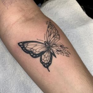 Explore the intricate beauty of blackwork and fine line styles with a geometric butterfly design by Nikita Jade Morgan.