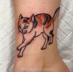 Adorn your ankle with a delicate and charming cat tattoo by talented artist Nikita Jade Morgan. Embrace your feline spirit!