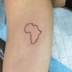 Explore the world with this intricate fine line map tattoo delicately inked on your upper arm by the talented artist Natalie Lucia.