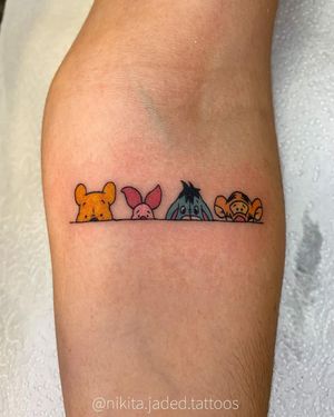 Illustrative tattoo featuring a bear, horse, tiger, pooh, pig, and donkey, inspired by Winnie the Pooh. Created by Nikita Jade Morgan.