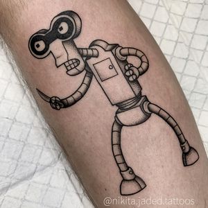 Unique blackwork design by Nikita Jade Morgan featuring a robotic figure holding a knife, perfect for the forearm.