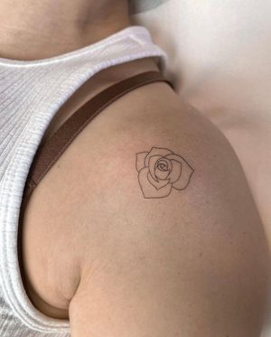 Elegant blackwork flower shoulder tattoo by the talented artist Dawid Szubert. This illustrative design is intricately detailed and stunning.