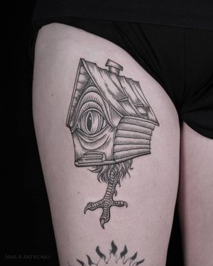 Exquisite upper leg tattoo featuring a unique design of a house, claw, and eye by Mara. Bold blackwork style with intricate details.