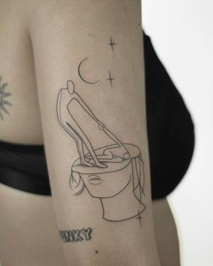 Unique upper arm tattoo featuring a star pattern with a woman and man in fine line illustrative style by Dawid Szubert.