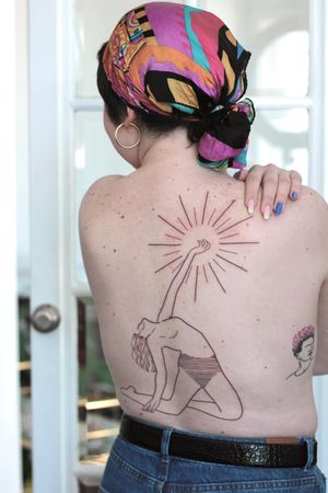 Beautiful back tattoo by Dominika Gajewska featuring an illustrative woman and intricate pattern in fine line blackwork style.