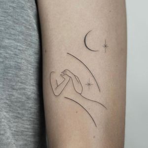 Elegant illustrative design by Dawid Szubert featuring a moon, star, and woman on the arm.
