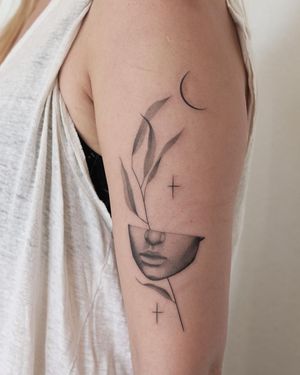 Beautiful tattoo featuring a star, flower, cross, and woman, created by talented artist Dawid Szubert.