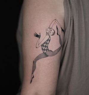 Elegant blackwork and fine line upper arm tattoo of a woman gracefully dancing, designed by Lena Dabska.