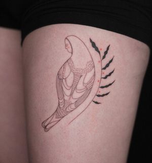Illustrative fine line tattoo of a woman with a bird and flower motif on the upper leg by Lena Dabska.