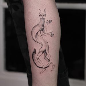 Blackwork and fine line tattoo of a cat on the forearm by Lena Dabska. Detailed and minimalist design.