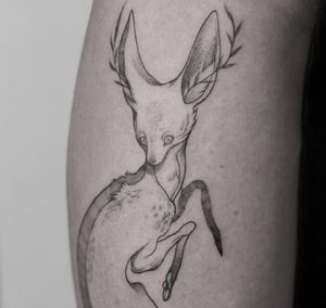 Capture the beauty of nature with this intricate blackwork illustration by Lena Dabska. Delicate fine line details bring this fox and sprig tattoo to life.