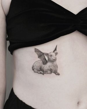 Martyna Śliwka's illustrative tattoo features a unique combination of a sheep and wings on the stomach in striking blackwork style.