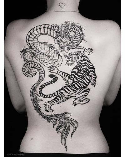 Stunning blackwork tattoo on the back featuring a fierce tiger and powerful dragon, created by the talented artist Mara.
