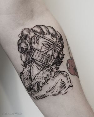 Discover Mara's fine line blackwork tattoo on the forearm, featuring a woman, tears, and a mask motif.
