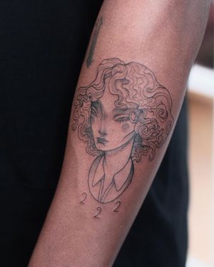 Intricately detailed blackwork tattoo by Lena Dabska featuring a woman and number design on forearm.