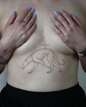 Get a stunning illustrative underboob tattoo of a dog by artist Dawid Szubert. Fine lines and intricate details make this piece a unique and elegant choice.