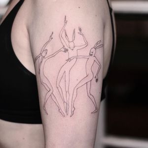 Delicate and detailed rabbit tattoo by Lena Dabska, perfect for the upper arm. The fine line work creates a beautiful illustrative design.