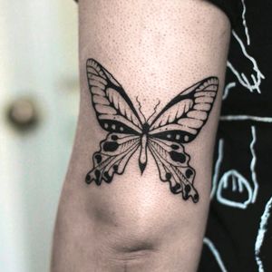 Discover the beauty of Kaśka's blackwork butterfly design adorning your upper arm. Let this intricate tattoo bring a touch of nature to your skin.