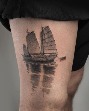 Sail away with this stunning black and gray dotwork tattoo of a boat and sails, expertly done by FKM TATTOO.
