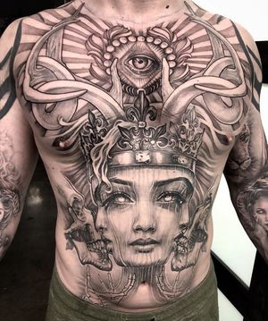 A stunning chest tattoo in Long Beach featuring a regal skull queen with intricate filigree and crown details.