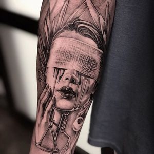 Get a powerful blackwork tattoo in Long Beach featuring a woman symbolizing justice with a blindfold and tears, representing balance and truth.