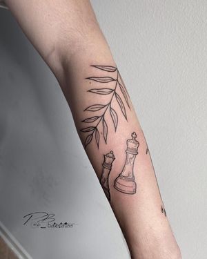 Unique blackwork and fine line forearm tattoo combining leaf and chess motifs, created by skilled artist Patrick Bates.