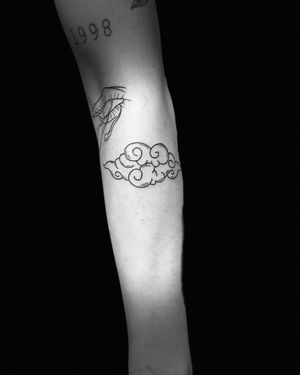 Get lost in the intricate blackwork clouds on your forearm by the talented artist Niklas Fogh.