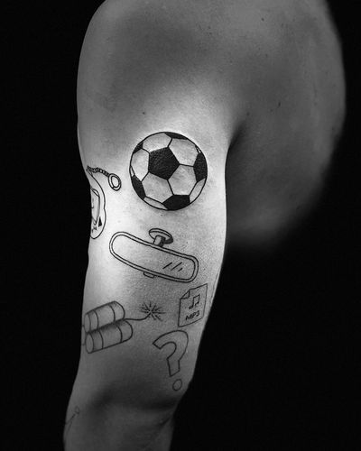 Capture your love for the game with a bold blackwork football ball tattoo by Niklas Fogh. Perfect for sports enthusiasts!