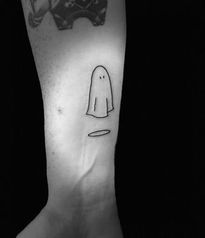 Get spooked with this fine line illustrative ghost tattoo by Niklas Fogh. Perfect for those who love eerie and unique body art.