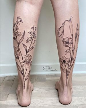 Elegant blackwork floral design on lower leg, expertly crafted by tattoo artist Patrick Bates. Illustrative style with delicate fine lines.