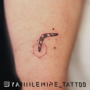 Elegant dotwork and fine line illustration of a boomerang pattern tattoo by talented artist Yann.
