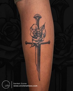 Sword and Rose Tattoo done by Sanket Gurav at Circle Tattoo Studio