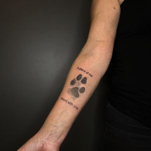 Fine line illustrative design featuring a dog, paw print, and quote by Yura. Perfect for a meaningful and stylish forearm tattoo.