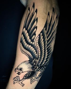 Bold blackwork eagle design by Eddy Ospina, symbolizing strength and freedom.