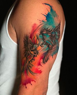 Illustrative bird tattoo on upper arm by Marcel Oliveira, featuring vibrant watercolor style.