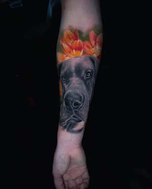 Get a stunning tattoo of a dog and flower in illustrative style by artist Marcel Oliveira. Perfect for dog lovers!